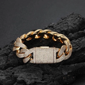 Luxury 20mm gold-plated cuban chain bracelet with pave zircons on black rock background
