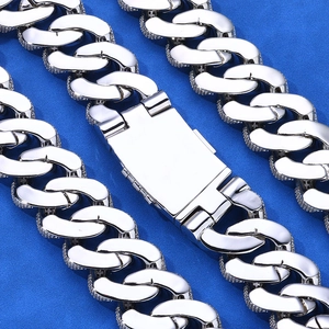 Macro view of silver Cuban link chain with micro-paved zircons and square buckle