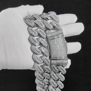 Macro detail of iced-out 29mm Cuban link chain with zircon pavé setting for men