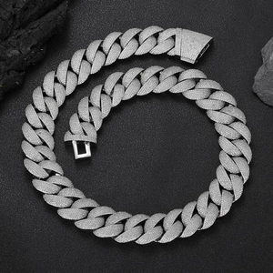 Iced out 24mm silver bubble Cuban link chain necklace with pave zircons on black rock base