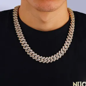 Close-up of men's gold plated Cuban link chain necklace with three rows of pavé zircons