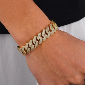 Detail of gold moissanite cuban link bracelet with iced-out geometric diamond links