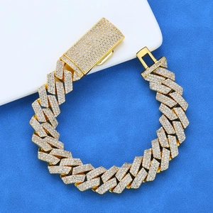 Detailed macro of gold Cuban link bracelet with iced-out pave moissanite stones