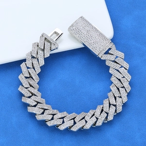 Mens iced out cubic zirconia cuban link bracelet with silver finish and pavé diamond setting