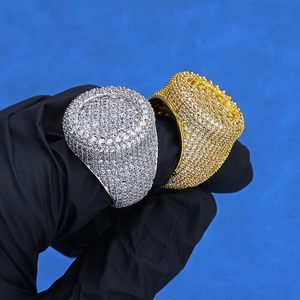 Hip-hop style gold and silver rings with full cubic zirconia pave on a blue background