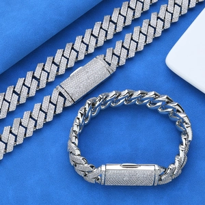 Detail of silver Cuban link necklace and bracelet with full pavé cubic zirconia