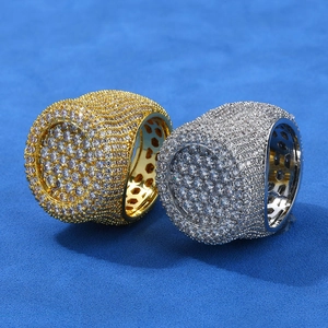 Close-up of iced out hip hop rings in gold and silver with micro pave setting