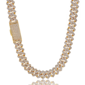 Macro shot of gold-plated cuban chain with luxury iced-out zircon pave diamond clasp