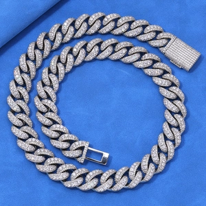 Close-up of hip-hop cuban link chain with zircon pavé and secure box clasp detail