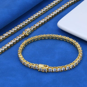 Detail of 925 silver tennis necklace with gold plating and white stones