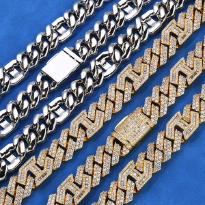 Detailed view of 15mm Cuban link chains with gold plating and paved zircon stones