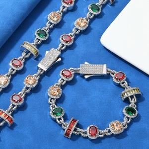 Detailed close-up of a hip hop silver bracelet with colorful gems and pave diamonds