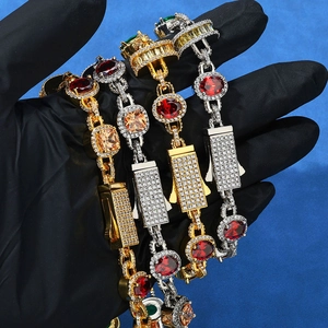 Detail of hip-hop iced-out necklaces with red and green gemstones and box clasp closures