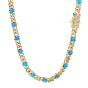 Detail of gold Cuban chain necklace with blue opal stones and sparkling pave diamonds