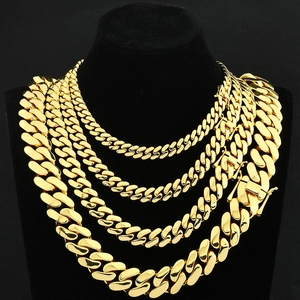 Polished gold Cuban link chains in multiple widths on black neck display stand