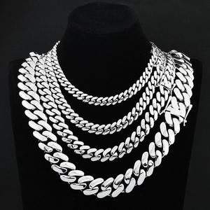 Polished silver cuban link chain necklace set for men in various widths on black display
