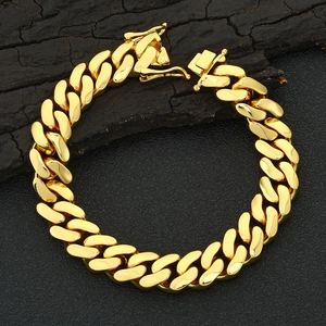 Close-up of polished gold Cuban link chain bracelet with secure buckle closure