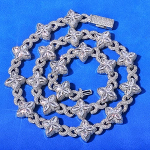 Close-up of sparkling cubic zirconia clover link chain with brilliant marquise cut stones