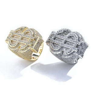 Close-up of iced out dollar sign hip hop rings with micro paved sparkling zircons