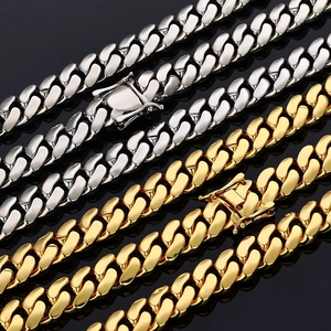 Detailed close-up of gold and silver S925 sterling silver Cuban link chains for men