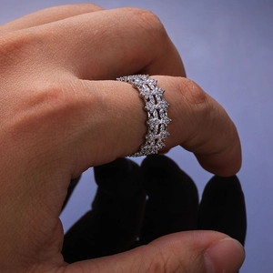 Detail shot of 8mm hip-hop ring featuring pave-set cubic zirconia on a wavy silver band