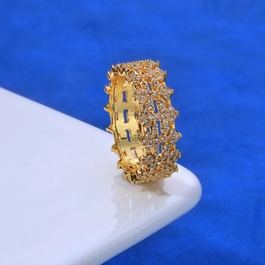 Macro side view of 8mm gold plated hip hop ring with paved zircons and gear edge detail