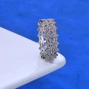 Macro shot of 8mm hip hop silver ring with micro-pave white zircons and gear edge detail