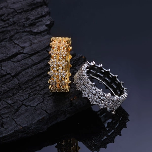 Detailed macro shot of 8mm hip hop rings with micro-pave zircons and spiked edges