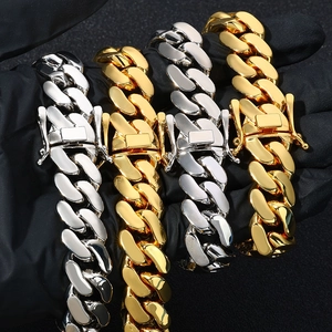 Polished Cuban link bracelet set in gold and silver finish with box clasp buckle