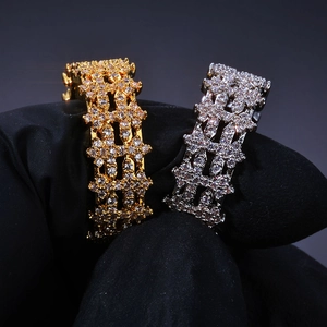 Macro shot of gold and silver iced out hip hop rings with micro-pave zircon crystals