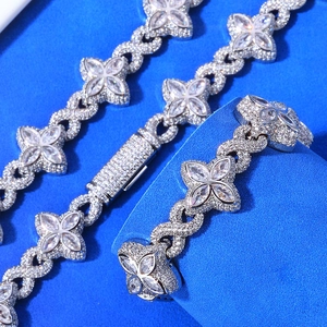 Detail of silver clover and infinity links with pavé-set zircons on a hip hop chain
