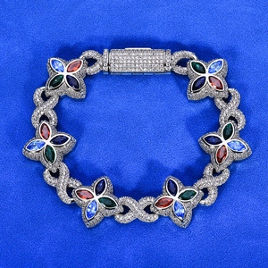 Detailed macro view of silver clover bracelet with multicolor pear-shaped gemstones