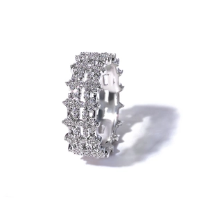 Macro shot of 8mm iced out hip hop ring with cross star pavé set cubic zirconia