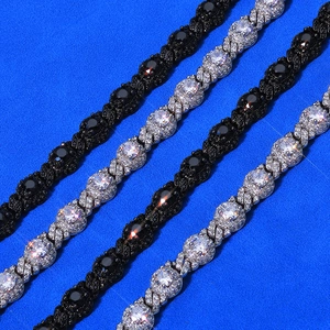 Detailed macro view of black and silver hip hop style chains with round zircon inlays