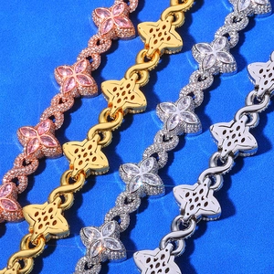 Hip-hop Cuban link bracelet with clover and infinity charms in multiple gold tones