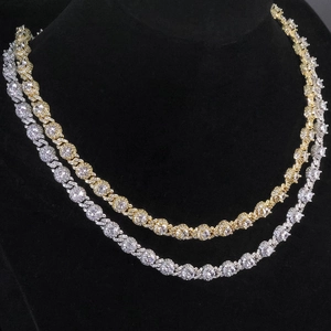 Close-up of gold and silver hip hop necklaces with 7.5mm round cubic zirconia pendants
