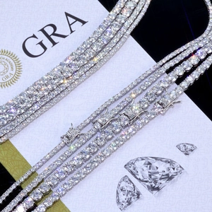 Macro shot of S925 sterling silver moissanite tennis chains with GRA certification folders