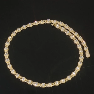 Close-up of 7.5mm gold hip hop Cuban chain necklace with iced out zircon pavé and box clasp