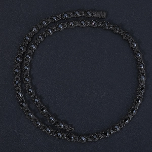 Detail of 7.5mm black cuban link chain with zircon stones and round black gemstones