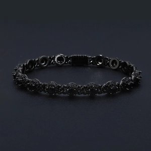Macro detail of 7.5mm black zircon cuban chain link with pave setting for men