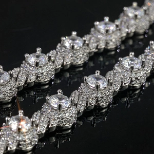 Macro view of 7.5mm iced out Cuban link bracelet with sparkling cubic zirconia inlay