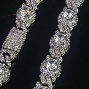 Macro shot of silver hip-hop cuban chain necklace with glittering zircon stones