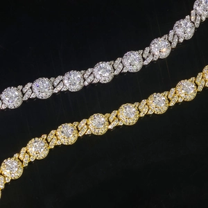 Macro detail of silver and gold tennis bracelets with brilliant-cut cubic zirconia inlays