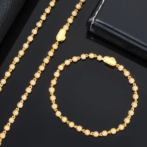 Detailed view of gold-plated 4mm round beads pave-set with moissanite on hip hop chain