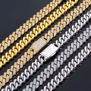 Macro detail of 14mm Cuban link chain with mixed baguette and round pave zircon stones