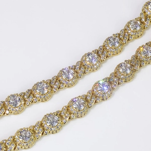 Close-up of 7.5mm gold plated Cuban link chain with round zircon stones in hip hop style
