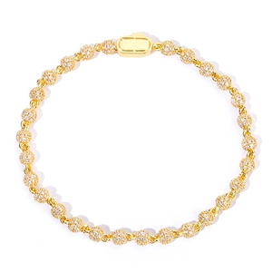 Close-up of 4mm golden bead chain bracelet with micro-paved moissanite stones