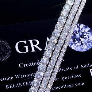 Macro shot of S925 silver moissanite tennis bracelets showing four-prong settings and fire