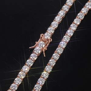 Macro view of rose gold tennis bracelet with brilliant-cut moissanite stones and secure clasp