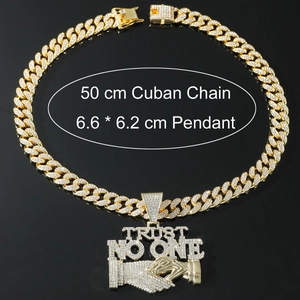 Detail view of iced out Trust No One pendant on golden Cuban chain with dimensions